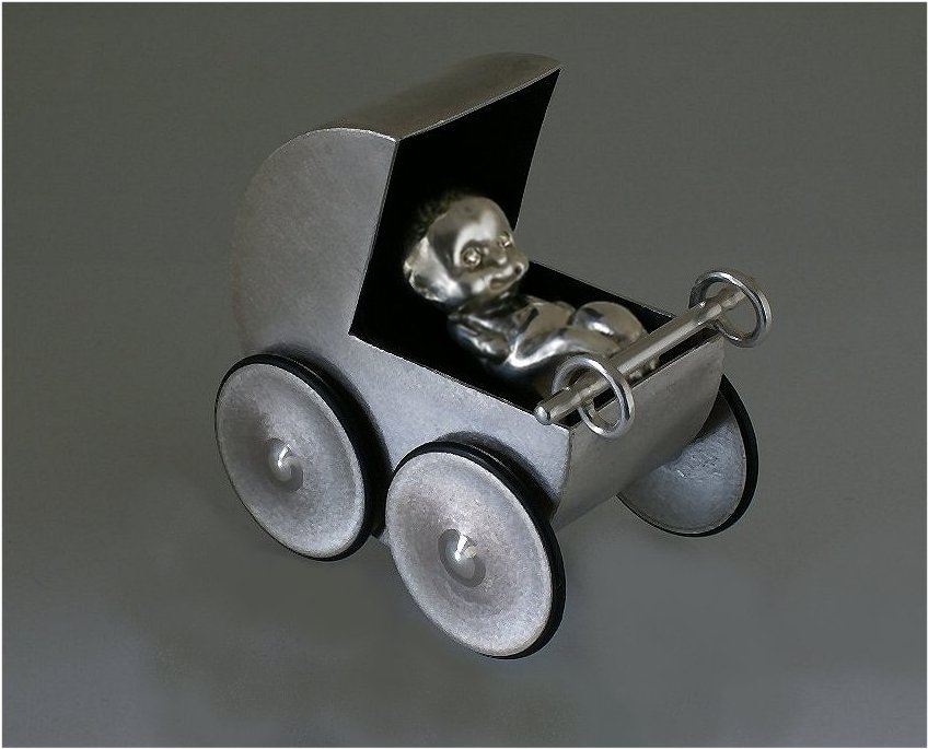 Pushable sterling silver pram and newborn baby